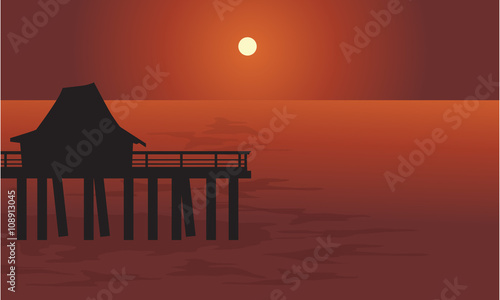 Pier and hut in sea