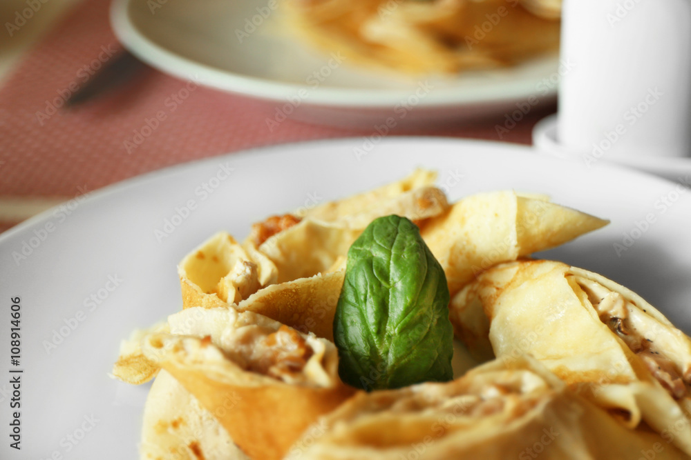 Tasty pancakes on plate in cafe, close up Tasty pancakes on plate in cafe, close up