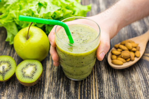 Wallpaper Mural Healthy green smoothie with kiwi, apple on rustic wood background. Torontodigital.ca