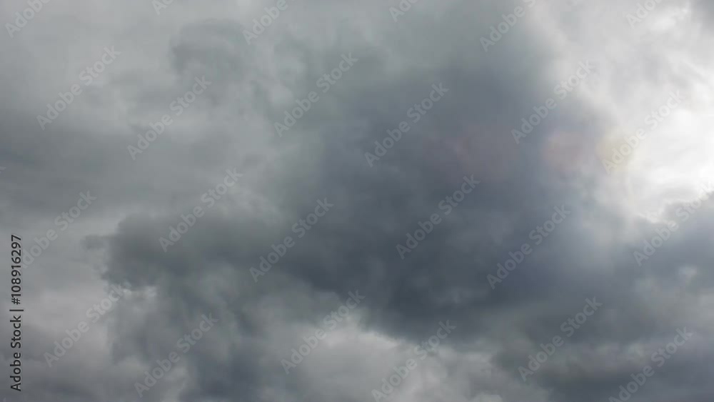 The storm cloud very quickly moves on the gray sky. The storm cloud very quickly moves on the gray sky.