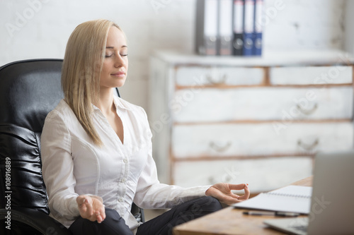 Business woman resting in yoga pose