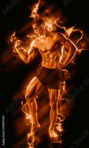 Sexy Athletic Man showing six pack abs with fire