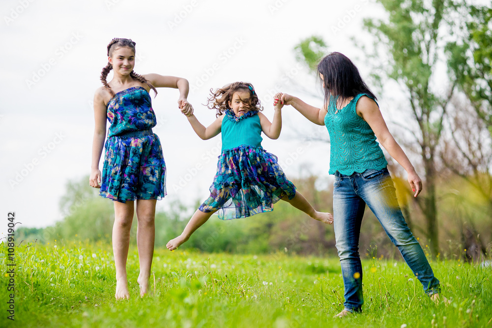 Beautiful Young Woman with Two Children in the park. Beautiful Young Woman with Two Children in the park.