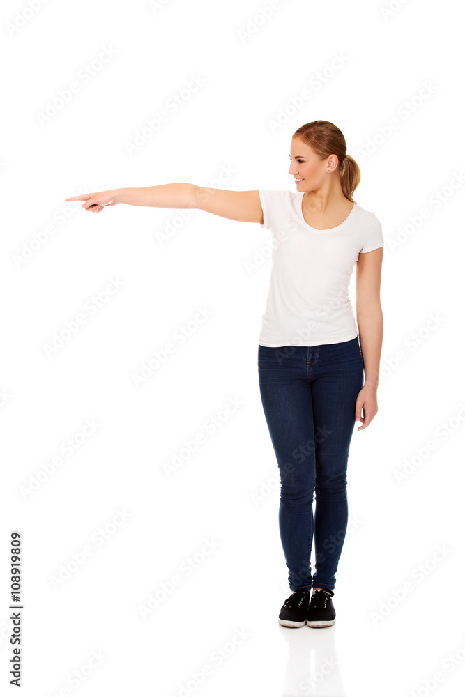 Student woman showing copyspace or something Student woman showing copyspace or something