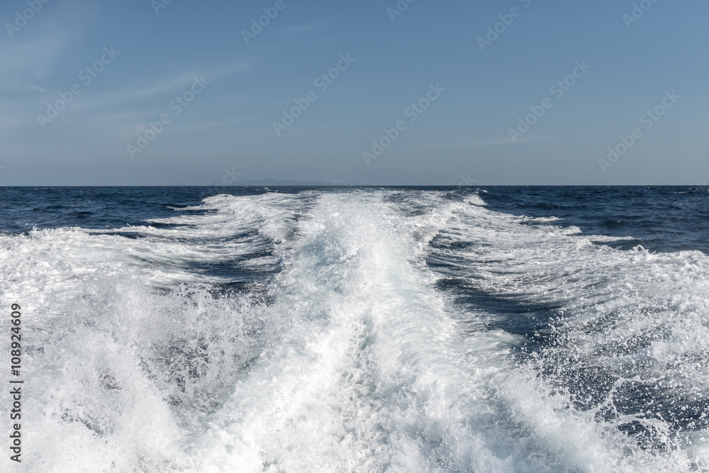 Fototapeta premium Water surface behind of fast moving motor boat