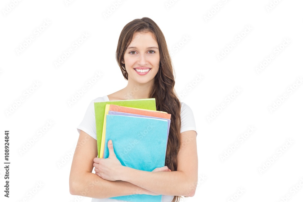 Portrait of smiling female college student holding books Portrait of smiling female college student holding books