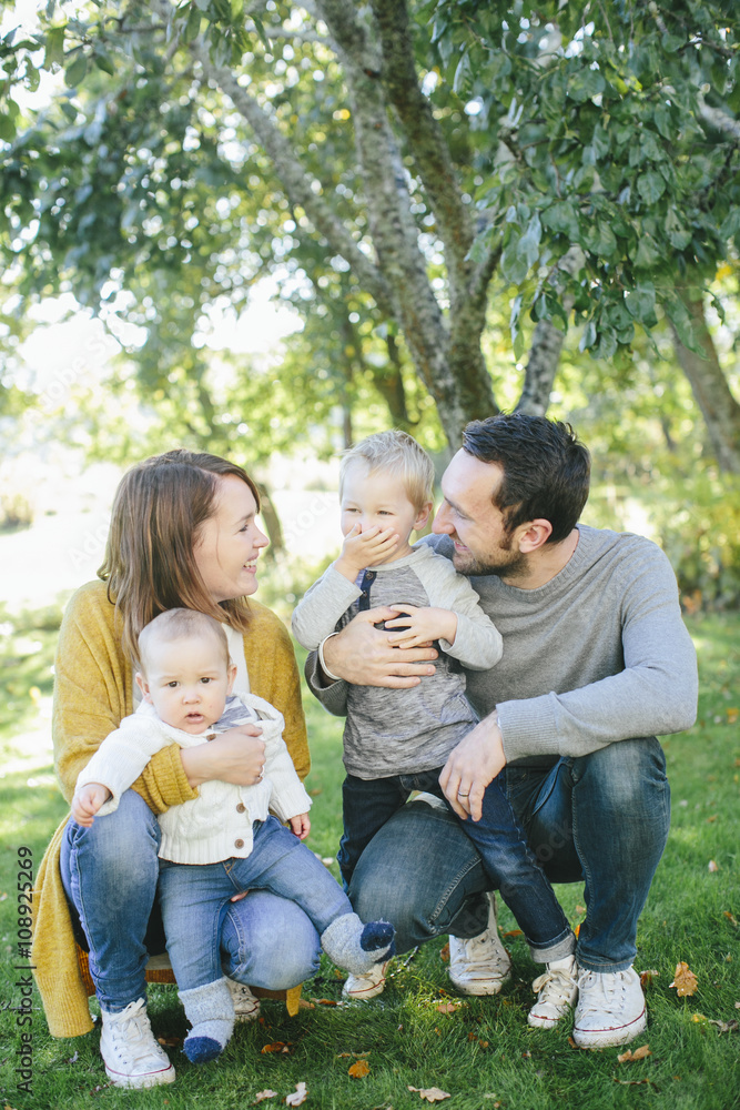 A happy family enjoying in a park A happy family enjoying in a park
