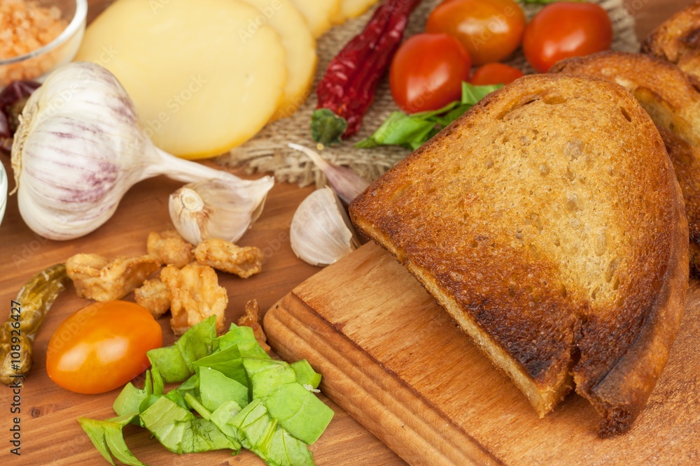 Fried bread with garlic and tomatoes. Toast to eat. Domestic food preparation. Quick to prepare meals for guests.
Fried bread with garlic and tomatoes. Toast to eat. Domestic food preparation. Quick to prepare meals for guests.