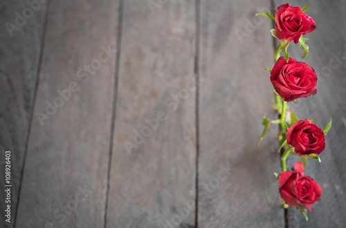 Red roses on wood background Retro vintage  Valentines Day