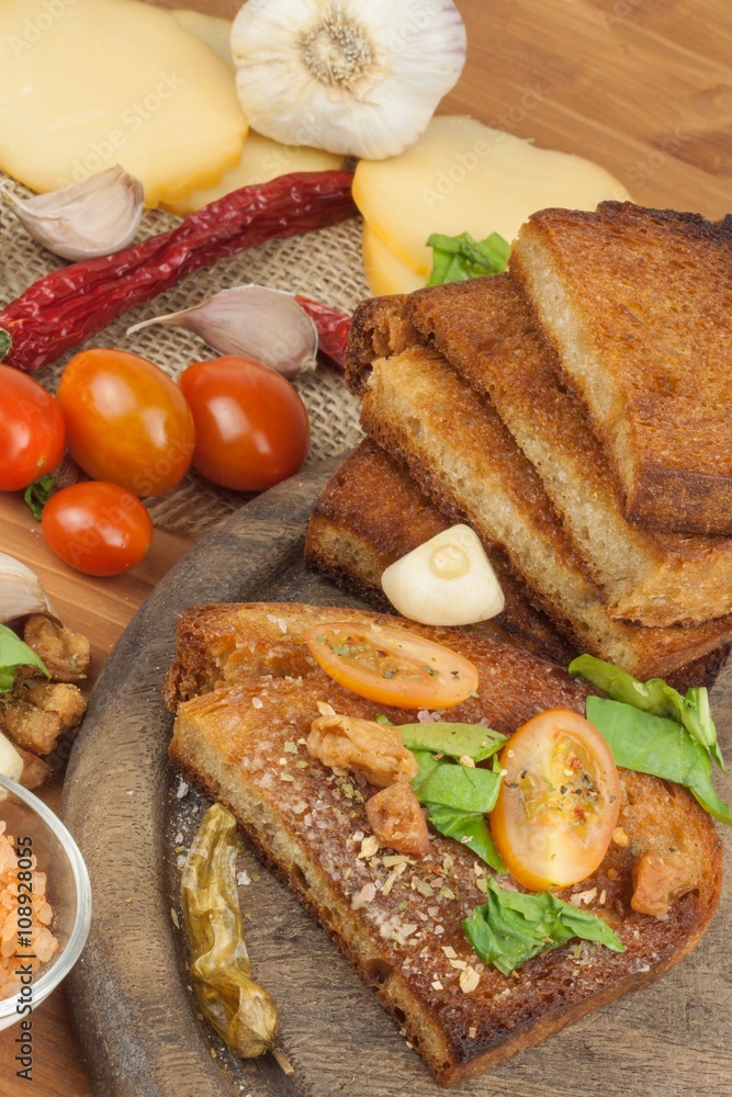 Fried bread with garlic and tomatoes. Toast to eat. Domestic food preparation. Quick to prepare meals for guests.
Fried bread with garlic and tomatoes. Toast to eat. Domestic food preparation. Quick to prepare meals for guests.