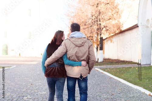 Young couple spring city, relax have fun, love each other, happy family, idea style concept relationships autumn clothes hands walking down the street