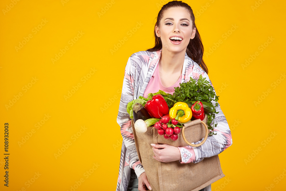woman with green vegan food. Shopping bag. surprise emotion. Yel woman with green vegan food. Shopping bag. surprise emotion. Yel