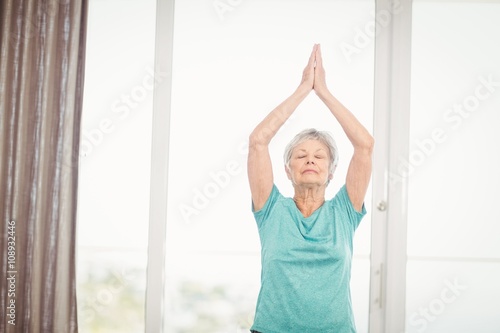 Senior woman performing yoga