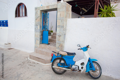 Santorini island with motorcycle on the street in Greece