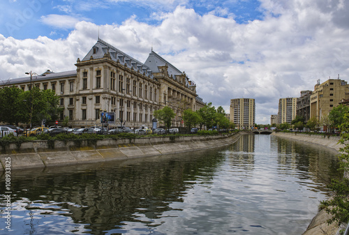 Bucharest, Romania - April 12, 2016: Dimbovita River and the Justice Palace in Unirii Square. © agcreativelab