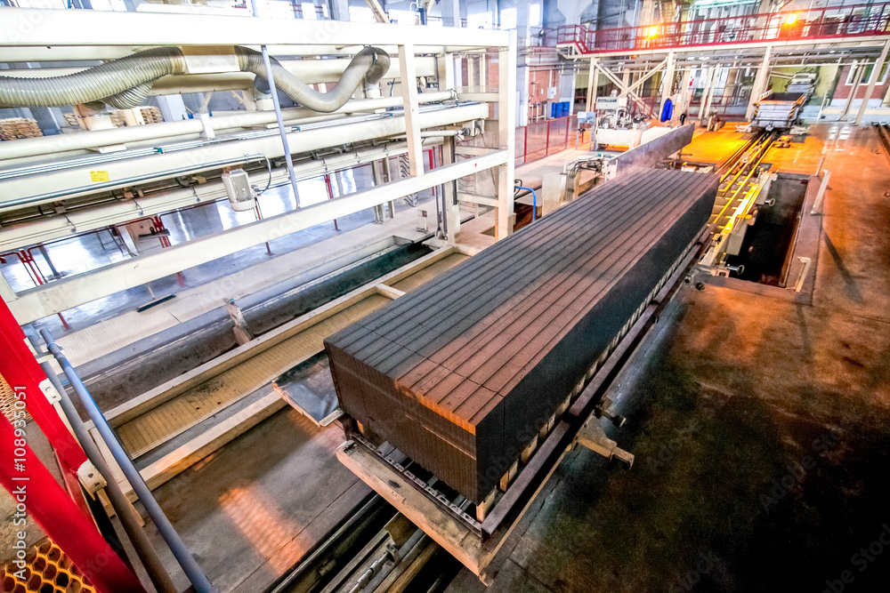 production facilities with automated machinery at factory producing blocks