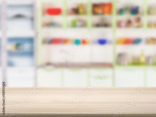 wooden counter top with kitchen cabinet background