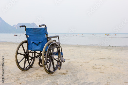 wheelchair on the beach in summer