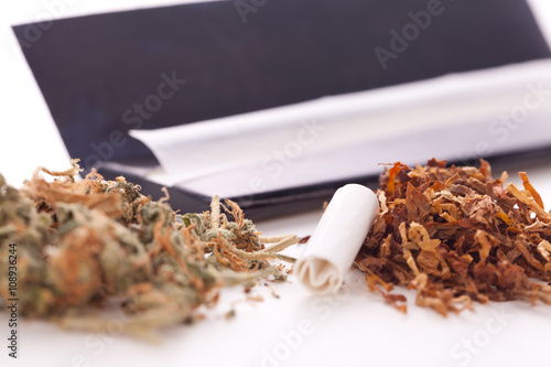 Dried Cannabis on Rolling Paper with Filter photo