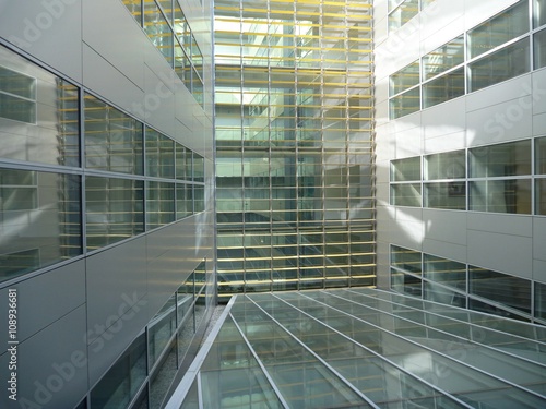glass atrium of a modern office buildind photo
