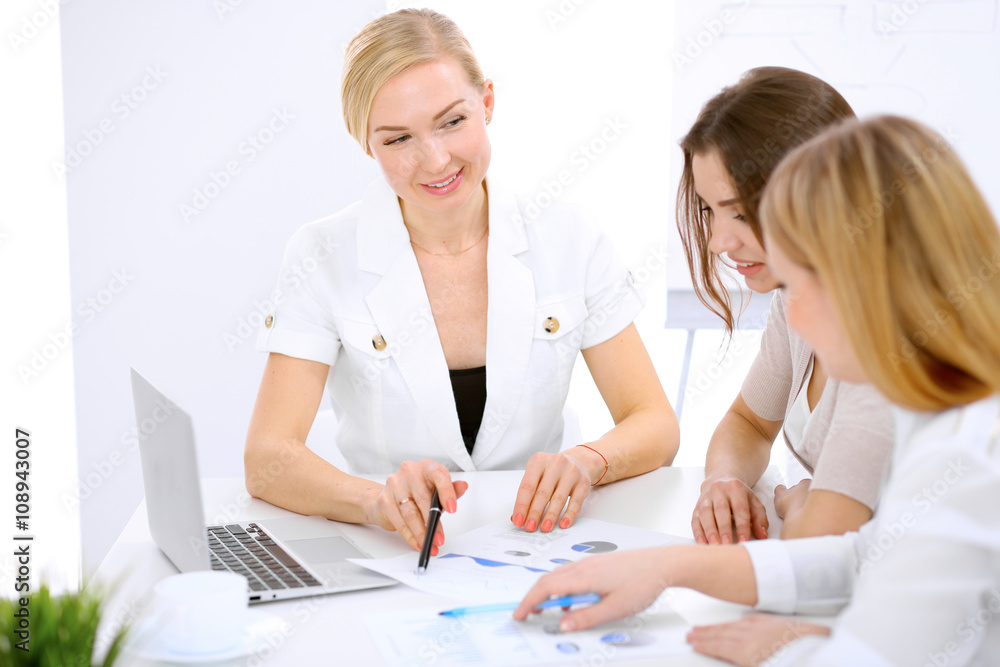 Group of business people at meeting in office Group of business people at meeting in office