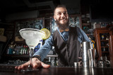 Barman serving cocktail.