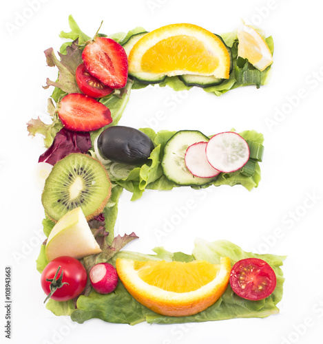 Letter E made of salad and fruits