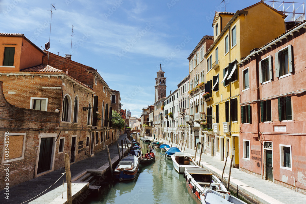 Canal with gondolas scene, Venice, Italy.