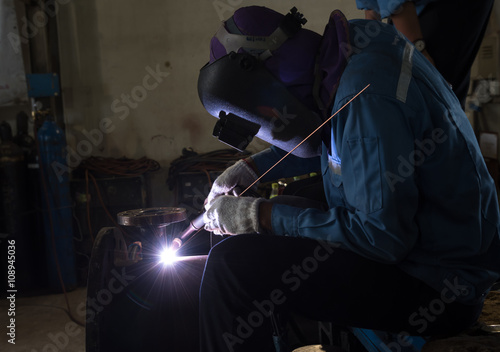 Welding with bright sparks. Tube manufacturing repair.