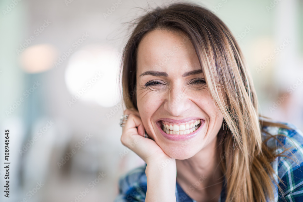 Fototapeta premium Portrait of cheerful woman