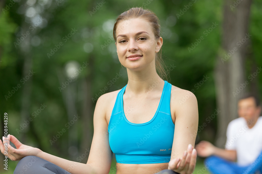 Fototapeta premium Having yoga practice in park