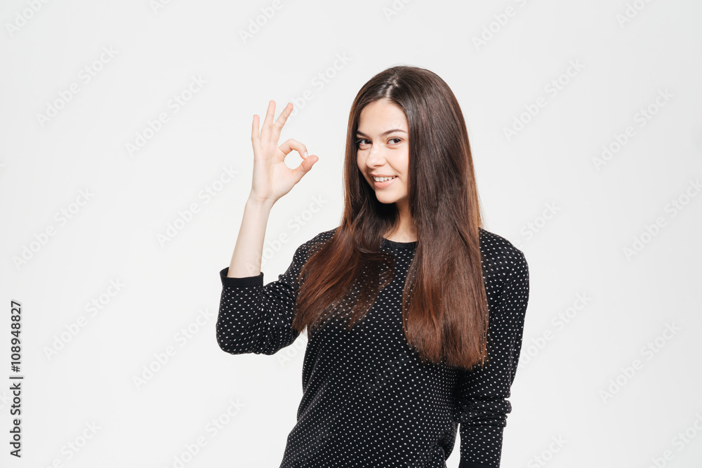 Smiling casual woman showing ok sign Smiling casual woman showing ok sign