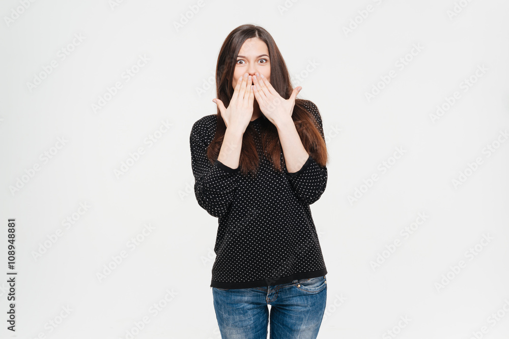 Amazed woman covering her mouth with palms Amazed woman covering her mouth with palms