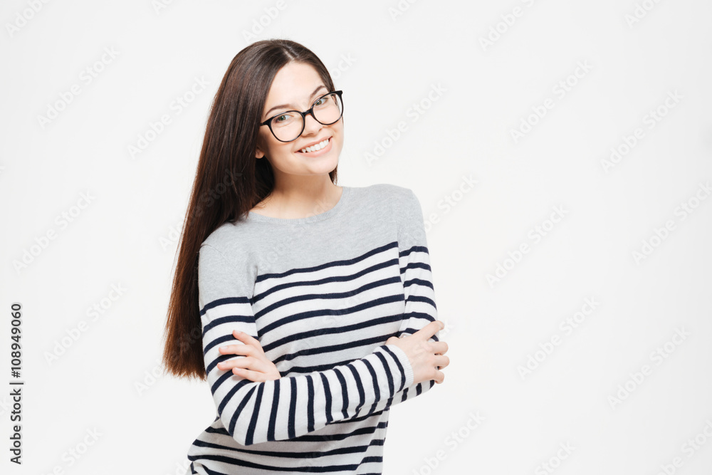 Smiling woman in glasses standing with arms folded Smiling woman in glasses standing with arms folded