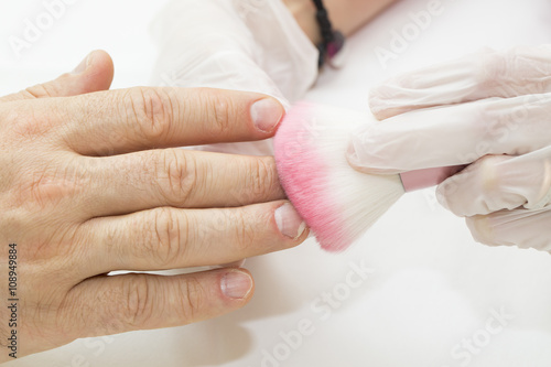 the process of the male manicure in a beauty salon