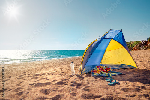 Beach scene with a beach tent © mRGB