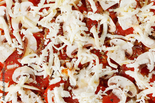 Cooking homemade pizza with...