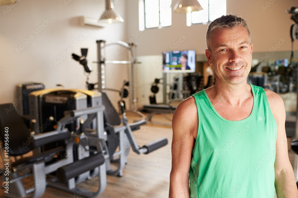 Portrait Of Mature Man Standing In Gym Portrait Of Mature Man Standing In Gym