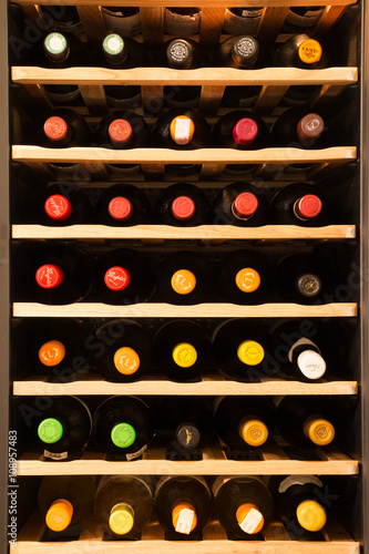 Wine cooler full of wine bottles
