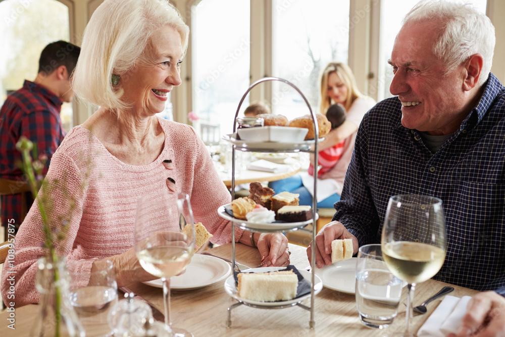 Senior Couple Enjoying Afternoon Tea In Restaurant Together Senior Couple Enjoying Afternoon Tea In Restaurant Together