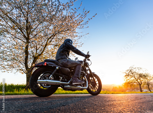 Young man driving chopper