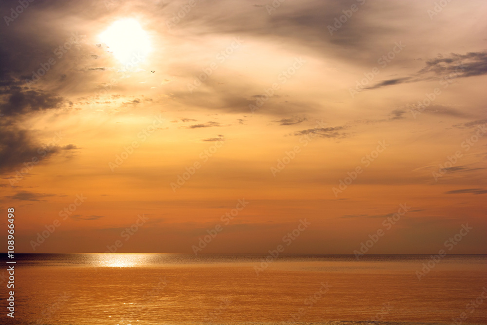 Beautiful sunset above the sea. Gold sea sunset landscape