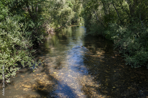 Views of the River Bernesga on its way through La Pola de Gordon Municipality, in Leon Province, Spain photo