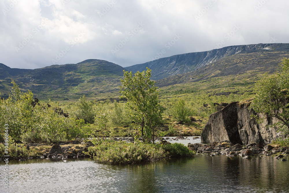 Severe beauty of Northern nature. Mountain lake in landscape of polar region. Severe beauty of Northern nature. Mountain lake in landscape of polar region.