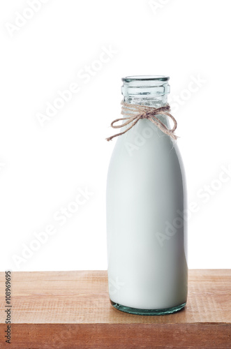 Old glass bottle full of fresh milk