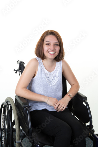 Smiling woman on the wheelchair isolated on white