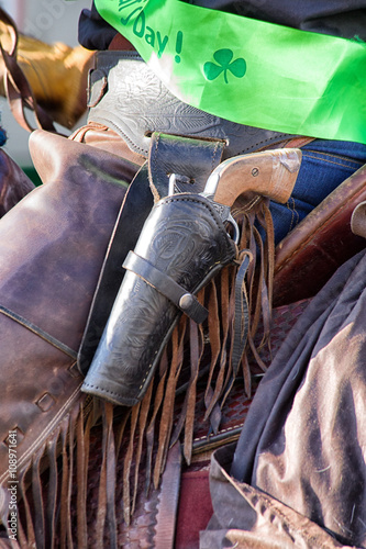 Cowboy on horse with Gun in holster
