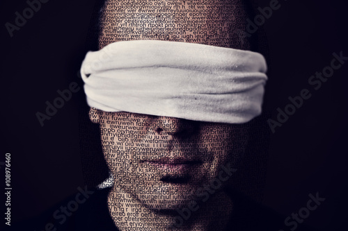 young man with a blindfold in his eyes photo