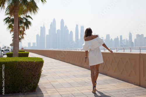 Photography Dubai travel tourist woman on vacation in the Palm Jumeirah walk