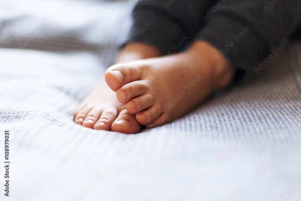 Feet of a little boy, close-up Feet of a little boy, close-up